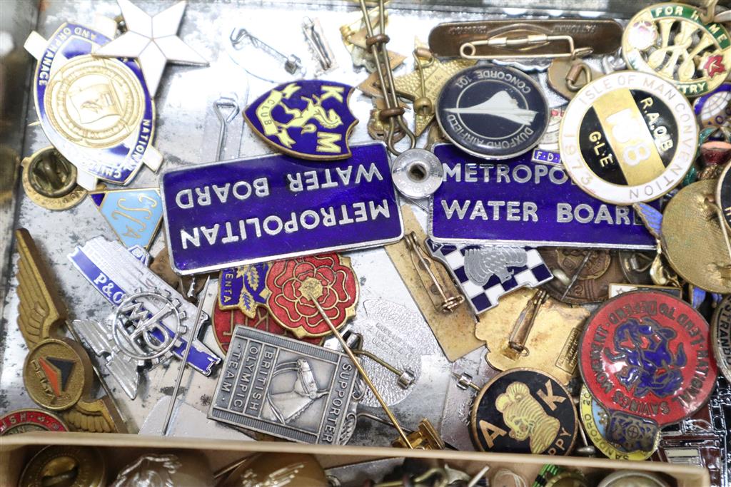 A quantity of badges, including military